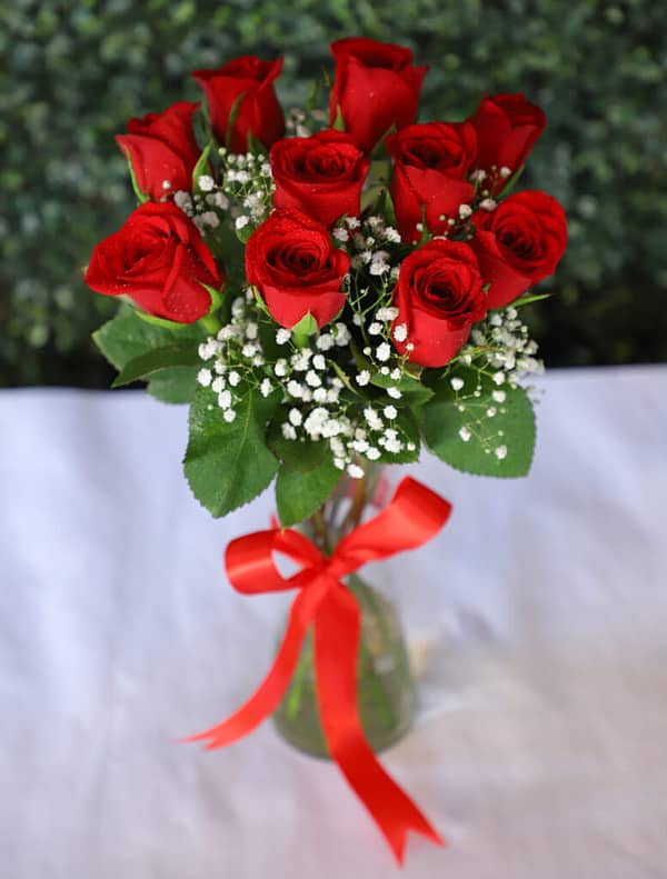 Red Roses In Glass Vase